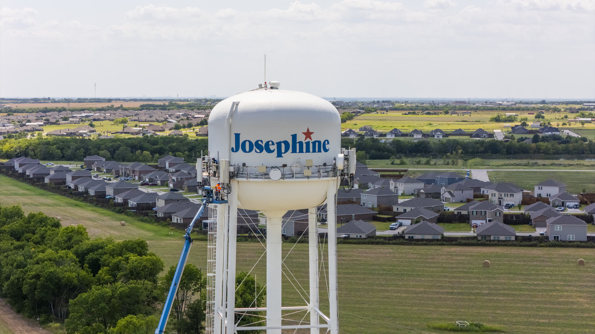 Aerial inspection view of cellular antennas on the Josephine water tower