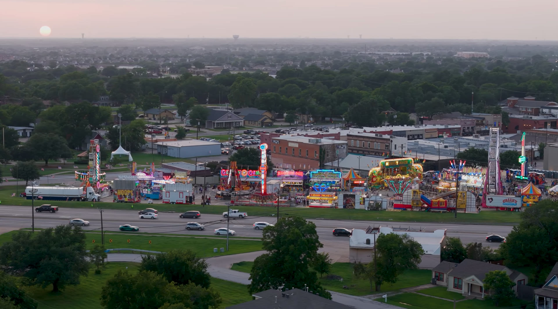 Aerial view of a summer carnival at sunset